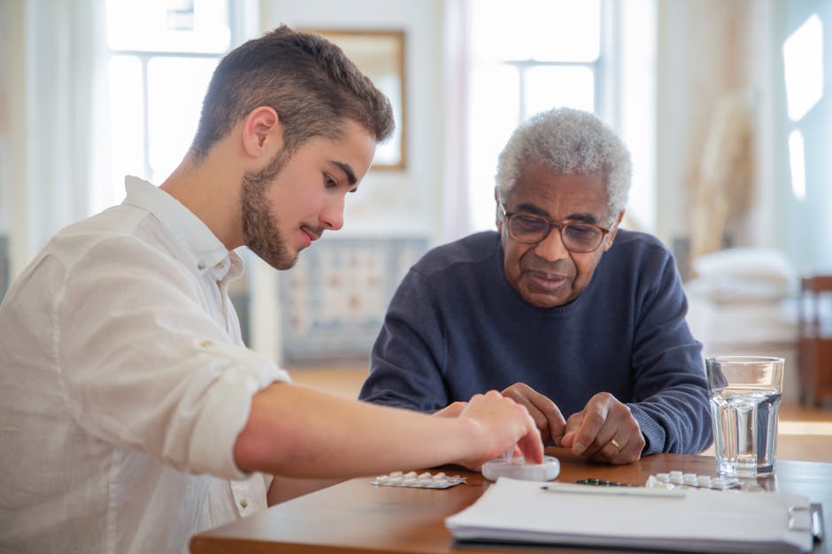 Volunteer teaching computer skills to senior citizen